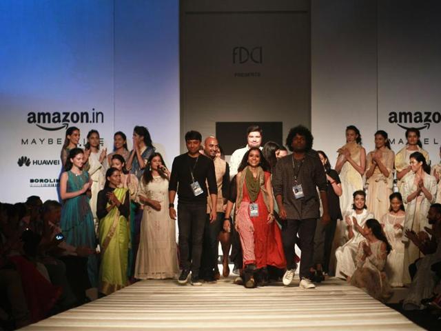 Designers take a bow with their models post the show. (Waseem Gashroo/HT Photo) 