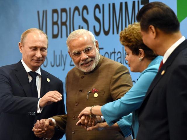 PM Modi with Russian President Vladimir Putin with leaders of other countries in the BRICS at the 7th BRICS Summit in Ufa.(PTI file photo) PM Modi with Russian President Vladimir Putin with leaders of other countries in the BRICS at the 7th BRICS Summit in Ufa.(PTI file photo)