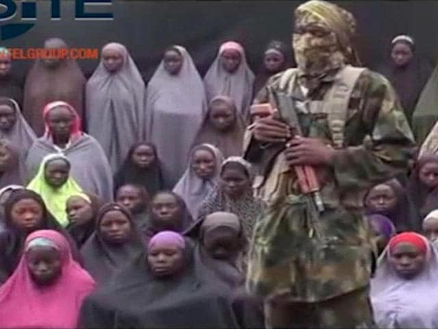 Twenty-one Chibok schoolgirls kidnapped by Boko Haram in 2014 were released on Thursday as part of a prisoner swap deal. (AP Photo) Twenty-one Chibok schoolgirls kidnapped by Boko Haram in 2014 were released on Thursday as part of a prisoner swap deal. (AP Photo)