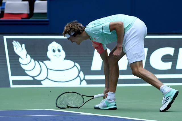 Alexander Zverev took his anger out on his racquet after getting broken for 5-6 in the third set. (AFP) Alexander Zverev took his anger out on his racquet after getting broken for 5-6 in the third set. (AFP)
