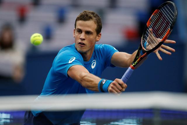 Pospisil plays a backhand slice against Djokovic. (REUTERS) Pospisil plays a backhand slice against Djokovic. (REUTERS)