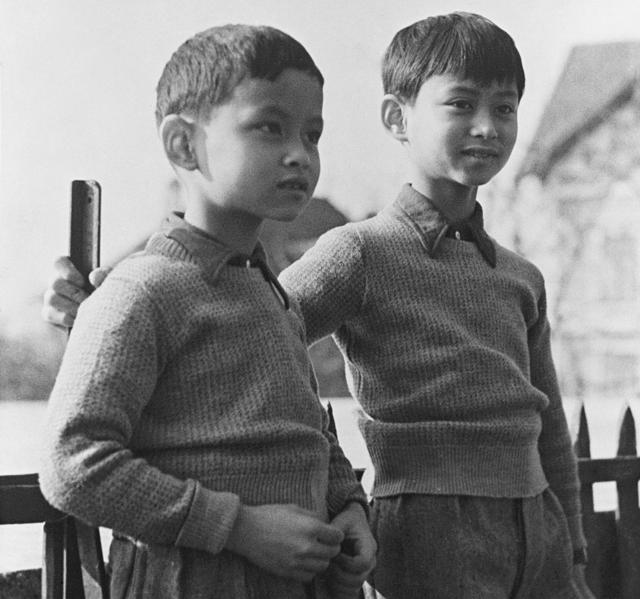 In this March 7, 1935, file photo, Prince Bhumibol, left, stands with his brother, King Ananda Mahidol of Siam, now known as Thailand, at their school in Lausanne Switzerland. King Bhumibol was born in 1927 in Cambridge, Massachusetts, where his father, Prince Mahidol, was then studying medicine. (AP)