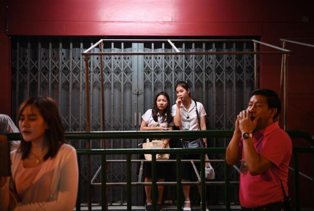 People react to the death of the Thailand's King (AFP)