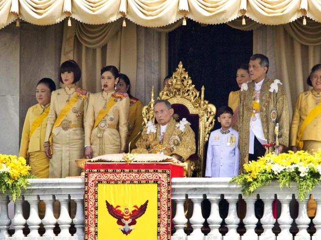 In this Dec. 5, 2012, file photo, Thailand's King Bhumibol Adulyadej, seated centre, and his family members, from left: Princess Somsavali, Princess Ubolratana, Princess Chulabhorn, Princess Siribhachudabhorn, Royal Consort Princess Srirasm, Prince Dipangkorn Rasmijoti, Crown Prince Vajiralongkorn, Princess Sirindhorn; after addressing the crowd from a balcony of the Ananta Samakhom Throne Hall on his 85th birthday in Bangkok. (AP)