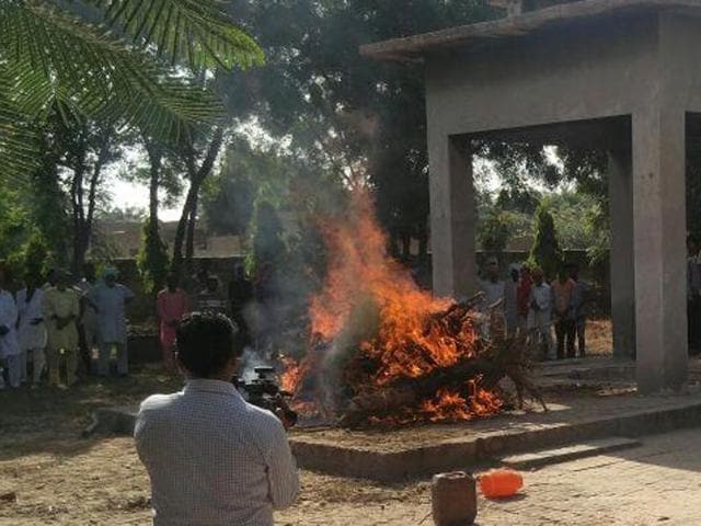 The body being cremated in Mansa on Friday. (HT Photo) The body being cremated in Mansa on Friday. (HT Photo)
