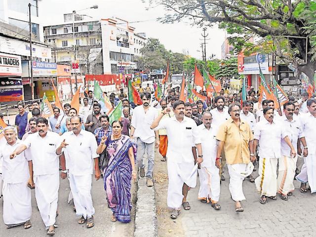 BJP activists take out a rally in Kochi on Thursday in protest against the murder of its party worker. (PTI)