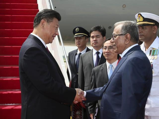 China's President Xi Jinping shakes hands with Bangladesh's President Abdul Hamid in Dhaka. (REUTERS) China's President Xi Jinping shakes hands with Bangladesh's President Abdul Hamid in Dhaka. (REUTERS)