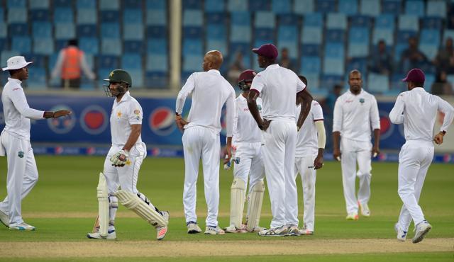 Sami Aslam (2L) walks off the ground after being dismissed. (AFP) Sami Aslam (2L) walks off the ground after being dismissed. (AFP)