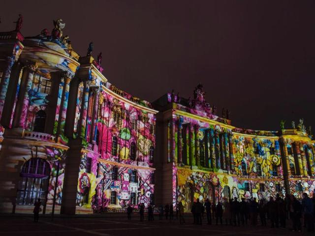 The first event was held in 2004 and celebrated its 10th anniversary in 2014. Colourful designs are projected on the Faculty of Law building of the Humboldt University. (AFP) 