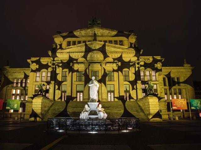 Numerous artists from Germany and abroad participate in the light installations and projections to create an extraordinary cityscape. Colourful designs are projected on the facade of the Berlin Concert Hall (Konzerthaus). (AFP) 