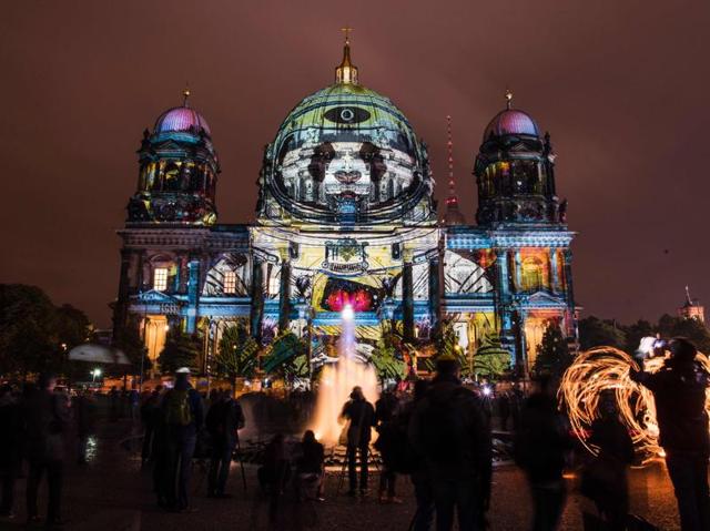 Colourful designs are projected on the facade of the Berlin Cathedral (Berliner Dom). (AFP) 