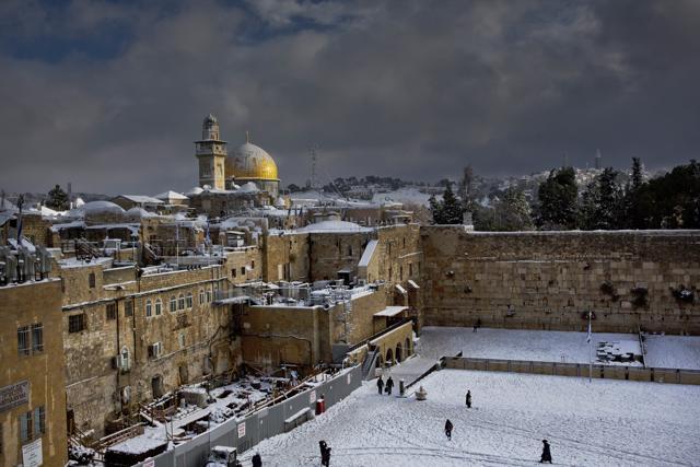 In this file photo, the Western Wall (right) and the gilded Dome of the Rock, among the holiest sites for Jews and Muslims, are covered in snow. (AP) In this file photo, the Western Wall (right) and the gilded Dome of the Rock, among the holiest sites for Jews and Muslims, are covered in snow. (AP)
