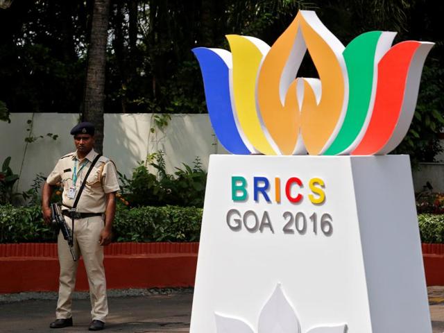 A security personnel stands guard outside one of the venues of BRICS Summit in Benaulim in Goa.(REUTERS)