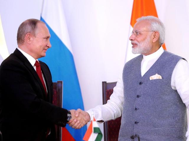 Prime Minister Narendra Modi shakes hands with Russian President Vladimir Putin during the exchange of agreements and joint press statements ceremony at Taj Exotica hotel in Goa on Friday. (AFP) Prime Minister Narendra Modi shakes hands with Russian President Vladimir Putin during the exchange of agreements and joint press statements ceremony at Taj Exotica hotel in Goa on Friday. (AFP)