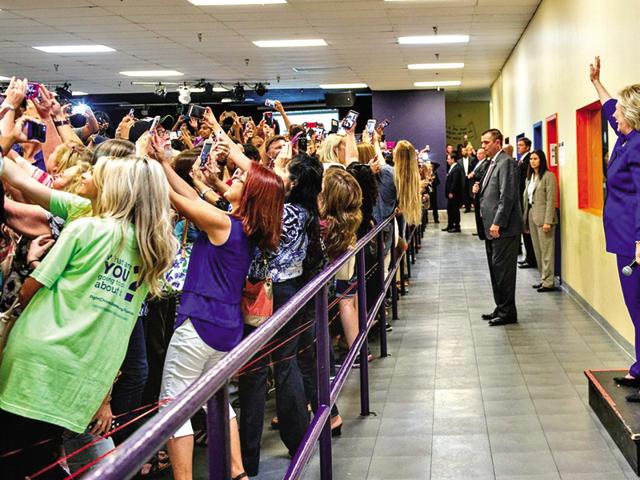 No looking back: This odd-looking photograph shows the crowd taking a selfie with Hillary Clinton