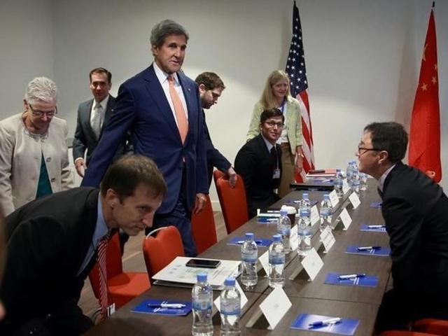 US Secretary of State John Kerry (standing, centre) during a bilateral meeting with Chinese deputy minister for environment protection, Zhai Qing to promote US climate and environmental goals, at the Meeting of the Parties to the Montreal Protocol on the elimination of HFCs use in Rwanda. (Reuters) US Secretary of State John Kerry (standing, centre) during a bilateral meeting with Chinese deputy minister for environment protection, Zhai Qing to promote US climate and environmental goals, at the Meeting of the Parties to the Montreal Protocol on the elimination of HFCs use in Rwanda. (Reuters)