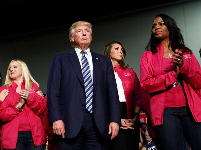 Republican US presidential nominee Donald Trump stands with female supporters on stage at a campaign rally in Charlotte, North Carolina, on October 14, 2016. (Reuters) Republican US presidential nominee Donald Trump stands with female supporters on stage at a campaign rally in Charlotte, North Carolina, on October 14, 2016. (Reuters)
