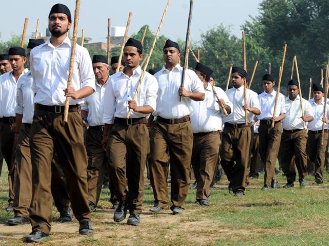 RSS volunteers take part in a parade march in full brown pants after the Shastra Pujan (Weapon worship) in DSD Government College in Gurgaon on October 11, 2016. (PARVEEN KUMAR / HT PHOTO) RSS volunteers take part in a parade march in full brown pants after the Shastra Pujan (Weapon worship) in DSD Government College in Gurgaon on October 11, 2016. (PARVEEN KUMAR / HT PHOTO)