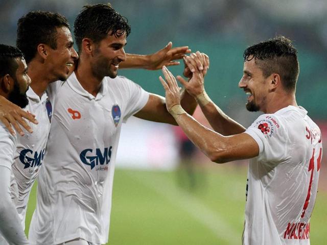 Delhi Dyanamos FC forward Marcelo Leite Pereira(L) celebrates along with his teammates after scoring a goal. (AFP Photo) Delhi Dyanamos FC forward Marcelo Leite Pereira(L) celebrates along with his teammates after scoring a goal. (AFP Photo)