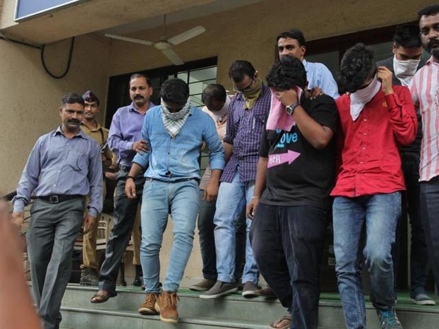 Police round up employees of the bogus call centres after raiding them.(HT file photo)