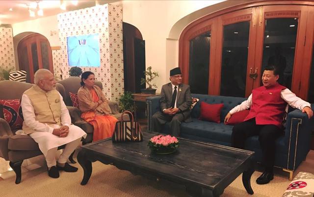 Prime Ministers Narendra Modi (left) and Nepal’s Pushpa Kamal Dahal ‘Prachanda’ (centre) with Chinese president Xi Jinping (right) in Goa on Saturday. (Prakash Dahal/Facebook) Prime Ministers Narendra Modi (left) and Nepal’s Pushpa Kamal Dahal ‘Prachanda’ (centre) with Chinese president Xi Jinping (right) in Goa on Saturday. (Prakash Dahal/Facebook)