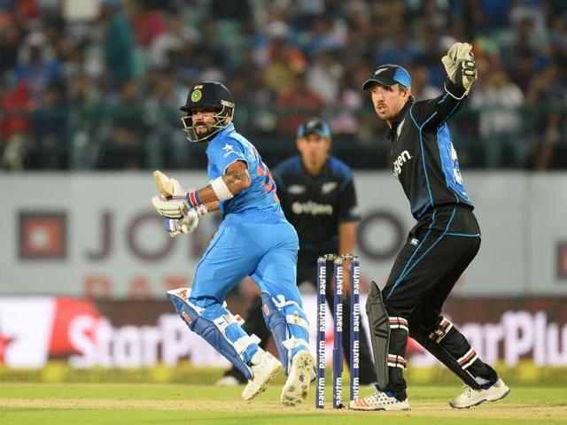 Indian batsman Virat Kohli plays a shot as New Zealand's Luke Ronchi looks on. (AFP photo)