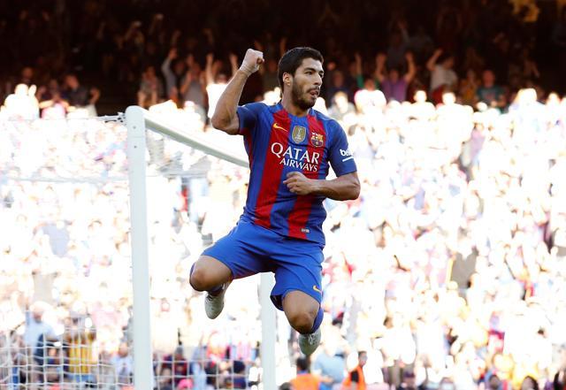 Suarez celebrates scoring a goal. (REUTERS) Suarez celebrates scoring a goal. (REUTERS)