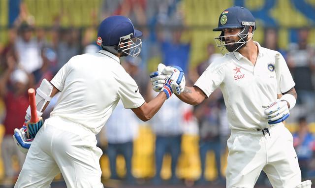 Ajinkya Rahane greets captain Virat Kohli as he walks to pavilion after his dismissal during the third Test match against New Zealand, in Indore. (PTI Photo) Ajinkya Rahane greets captain Virat Kohli as he walks to pavilion after his dismissal during the third Test match against New Zealand, in Indore. (PTI Photo)