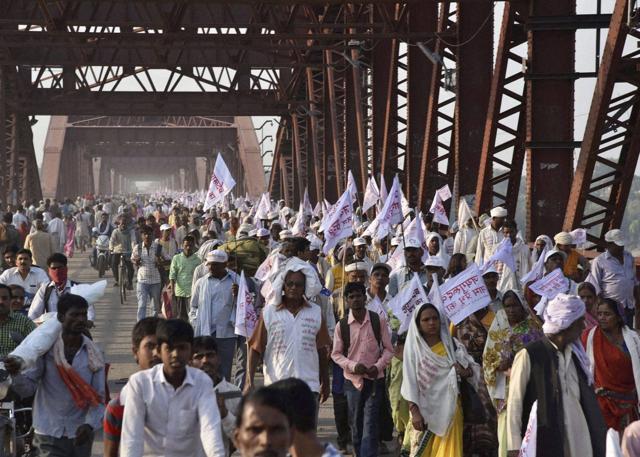 Baba Jai Gurudev supporters crossing the crowded Rajghat Bridge for a meeting in Varanasi where a stampede took place on Saturday (PTI) Baba Jai Gurudev supporters crossing the crowded Rajghat Bridge for a meeting in Varanasi where a stampede took place on Saturday (PTI)