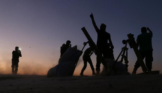 Syrian rebels cheer and react as they fight against the Islamic State (IS) group jihadists on the outskirts of the northern Syrian town of Dabiq, on Saturday. (AFP Photo) Syrian rebels cheer and react as they fight against the Islamic State (IS) group jihadists on the outskirts of the northern Syrian town of Dabiq, on Saturday. (AFP Photo)