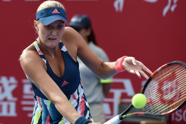 Mladenovic plays a backhand slice against Wozniacki. (AFP) Mladenovic plays a backhand slice against Wozniacki. (AFP)