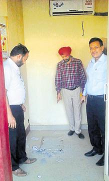 The point to which officials are gesturing had the ATM affixed to it. (HT Photo)