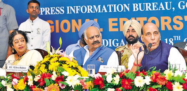 Chandigarh MP Kirron Kher, Punjab governor VP Singh Badnore and Union home minister Rajnath Singh at a conference in Chandigarh on Friday. (Keshav Singh/HT Photo)