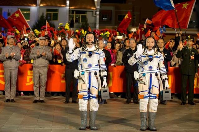 Chinese astronauts Jing Haipeng (right) and Chen Dong wave before the launch of Shenzhou-11 manned spacecraft, in Jiuquan, China. (Reuters) Chinese astronauts Jing Haipeng (right) and Chen Dong wave before the launch of Shenzhou-11 manned spacecraft, in Jiuquan, China. (Reuters)