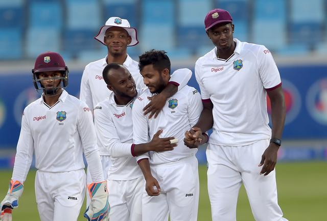 Bishoo (2R) celebrates with teammates after taking the wicket of Asad Shafiq. (AFP) Bishoo (2R) celebrates with teammates after taking the wicket of Asad Shafiq. (AFP)