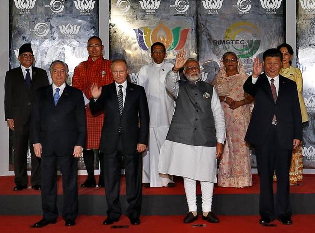 (L-R) Brazil's President Michel Temer, Russian President Vladimir Putin, Prime Minister Narendra Modi, Chinese President Xi Jinping and South African President Jacob Zuma pose for a group picture during BRICS and BIMSTEC summit in Cavelossim, Goa. (Reuters Photo) (L-R) Brazil's President Michel Temer, Russian President Vladimir Putin, Prime Minister Narendra Modi, Chinese President Xi Jinping and South African President Jacob Zuma pose for a group picture during BRICS and BIMSTEC summit in Cavelossim, Goa. (Reuters Photo)