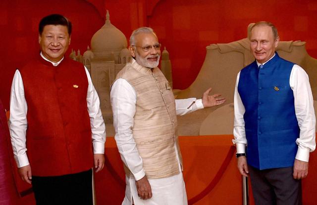 Prime Minister Narendra Modi with BRICS leaders Russian President Vladimir Putin, Chinese President Xi Jinping in front of sand sculpture made by Sudarsan Pattnaik. (PTI) Prime Minister Narendra Modi with BRICS leaders Russian President Vladimir Putin, Chinese President Xi Jinping in front of sand sculpture made by Sudarsan Pattnaik. (PTI)