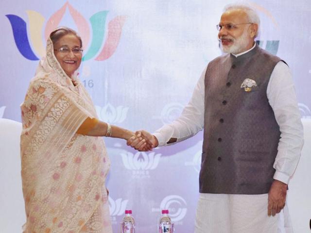 Prime Minister Narendra Modi with his Bangladeshi counterpart Sheikh Hasina at a bilateral meeting on the sidelines of BRICS-BIMSTEC Outreach summit in Goa on Sunday. (PTI) Prime Minister Narendra Modi with his Bangladeshi counterpart Sheikh Hasina at a bilateral meeting on the sidelines of BRICS-BIMSTEC Outreach summit in Goa on Sunday. (PTI)