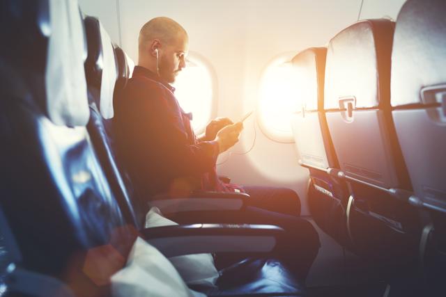 Being a pleasant airline passenger depends, in part, on how many times you have flown, say researchers. (Shutterstock)