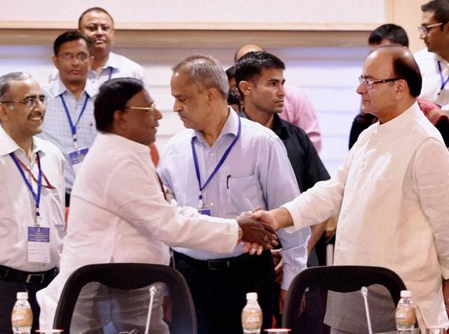 Union finance minister Arun Jaitley and Puducherry chief minister V Narayanasamy shake hands at the meeting of the GST Council at Vigyan Bhawan in New Delhi on Tuesday.(PTI Photo) Union finance minister Arun Jaitley and Puducherry chief minister V Narayanasamy shake hands at the meeting of the GST Council at Vigyan Bhawan in New Delhi on Tuesday.(PTI Photo)