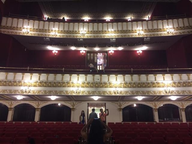 Visitors click picture of the three-tier auditorium, laced with artwork and murals.  (Aalok soni/ht photo) 