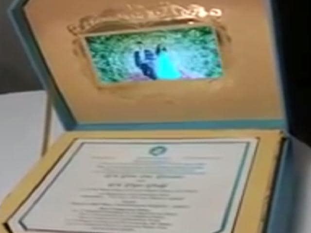 The wedding invitation is actually a box, which opens to display a small LCD screen playing a pre-wedding video of Reddy’s daughter Bramhani with son-in-law Rajeev.(YouTube screengrab) The wedding invitation is actually a box, which opens to display a small LCD screen playing a pre-wedding video of Reddy’s daughter Bramhani with son-in-law Rajeev.(YouTube screengrab)