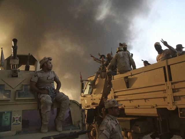 Iraqi forces deployed during an offensive to retake Mosul from Islamic State militants outside Mosul, Iraq, on Tuesday. (AP) Iraqi forces deployed during an offensive to retake Mosul from Islamic State militants outside Mosul, Iraq, on Tuesday. (AP)