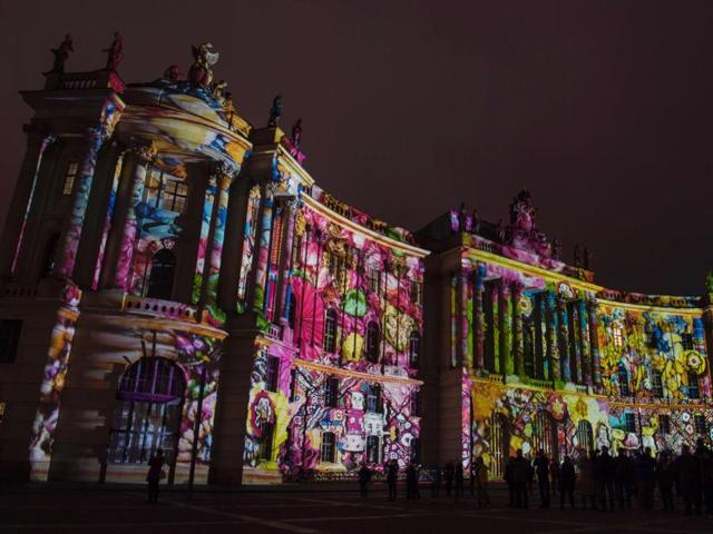 Colourful designs are projected on the faculty of law building of the Humboldt University. (AFP Photo)