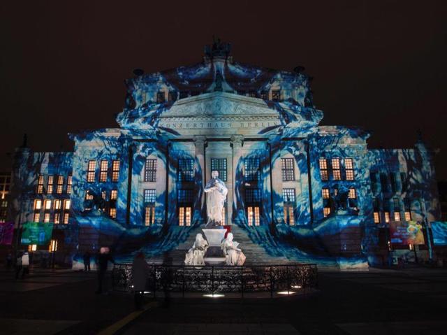 Colourful designs are projected on the facade of the Berlin Concert Hall (Konzerthaus) on the Gendarmenmarkt during the Festival of Lights in Berlin. (AFP Photo)