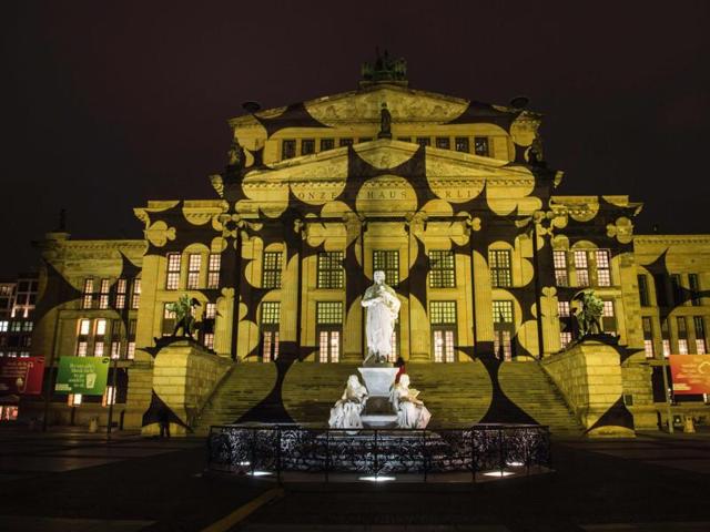 Colourful designs are projected on the facade of the Berlin Concert Hall (Konzerthaus) on the Gendarmenmarkt . (AFP Photo)