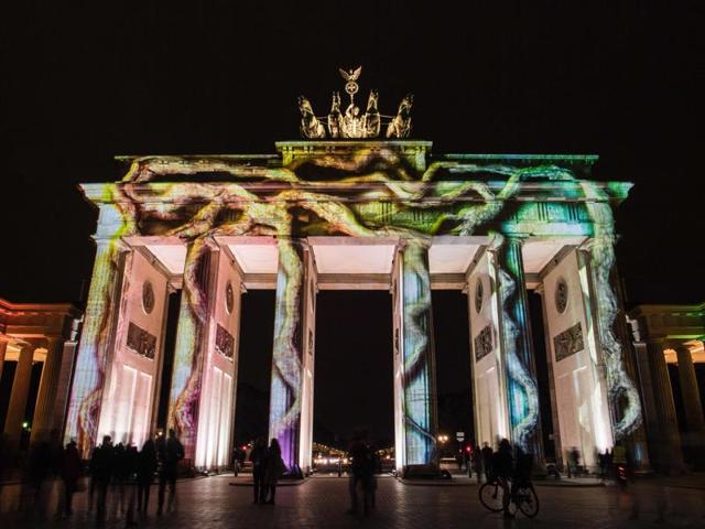Colourful designs are projected on the facade of the Brandenburg Gate during the Festival of Lights in Berlin. (AFP Photo)