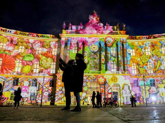 The juridical library of the Humboldt University is illuminated by colorful lighting in Berlin, Germany as part of the Festival of Lights. (AP Photo)
