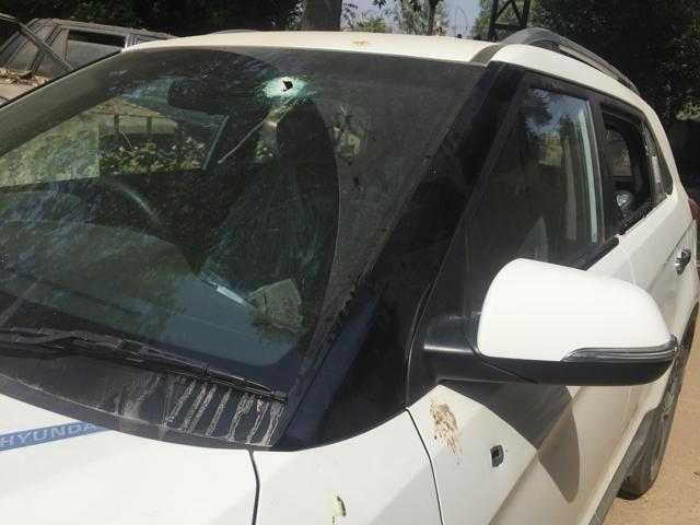 At least 15 rounds were fired at the Hyundai Creta SUV in which Manish Gujjar and two others were travelling. Five bullets hit Manish including one in head. (Parveen Kumar/HT Photo) At least 15 rounds were fired at the Hyundai Creta SUV in which Manish Gujjar and two others were travelling. Five bullets hit Manish including one in head. (Parveen Kumar/HT Photo)