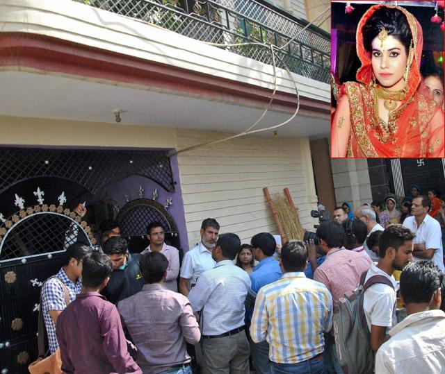 People gather after Lalita (inset), wife of national level kabaddi player Rohit Kumar was found hanging at her home in Nangloi, New Delhi on October 17, 2016. (PTI) People gather after Lalita (inset), wife of national level kabaddi player Rohit Kumar was found hanging at her home in Nangloi, New Delhi on October 17, 2016. (PTI)